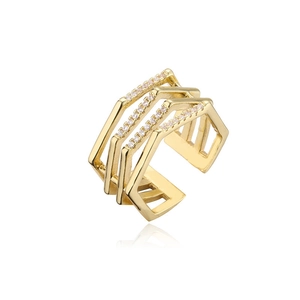 Macro view of gold plated multi-layer geometric ring with white cubic zirconia stones