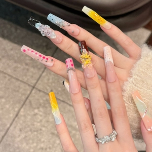Handmade ice lotus press-on nails in long ballerina shape with 3D floral and glitter