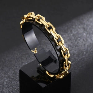 Polished 18K gold plated stainless steel O-chain bracelet for men on a black display stand
