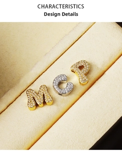 Close-up of M, C, and P letter charms with sparkling pavé cubic zirconia settings