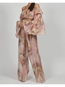 Detail of floral print chiffon set with off-shoulder crop top and wide leg trousers