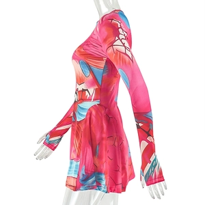 Detail view of pink printed long sleeve dress with geometric patterns and thumbhole cuffs