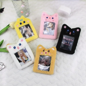 Detail of five colorful plush cat card holders with embroidery and metal chains