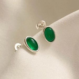925 Sterling Silver oval stud earrings with translucent green agate on twill fabric