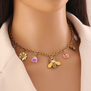 Gold stainless steel necklace with daisy, bee, butterfly and purple flower pendants