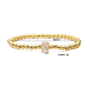 Elastic beaded bracelet with gold round beads and zircon-studded H letter charm