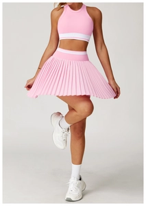 Detail of pink seamless racerback sports vest and pleated tennis skirt with white stripes