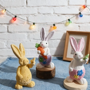 Detailed trio of Easter bunny figurines with knitted textures and carrot accents