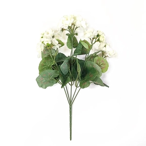 Close-up of artificial white geranium flowers with realistic green leaves and stem