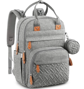 Close-up of grey fabric texture with brown leather zipper detail on a large diaper backpack