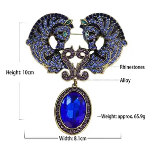 Detailed view of large vintage seahorse brooch with blue stones and crystals