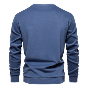 Rear view of a navy blue long-sleeve crewneck sweatshirt with ribbed cuffs and hem
