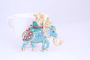 Macro detail of elephant keychain with colorful rhinestones and enamel on metal