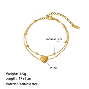 Dual-layer stainless steel heart pendant bracelet in gold finish with sizing details