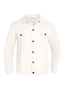 Detail of white waffle texture jacket with standing collar and contrast black buttons