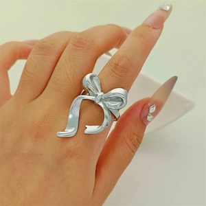 Elegant minimalist silver stainless steel bow ring with adjustable open band for women