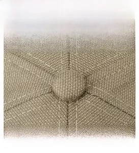 Detailed macro view of the khaki woven fabric texture and top button on the baseball cap