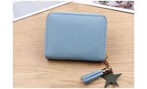 Detail of light blue PU coin purse with matching tassel and green star zipper charm