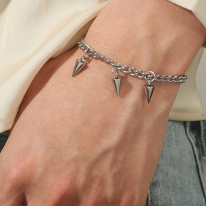 Industrial punk style stainless steel bracelet with three minimalist cone rivet pendants