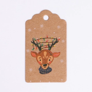 Detail of kraft paper Christmas gift tag featuring a reindeer with festive light strings