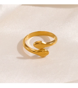 Detailed close-up of a 18K gold-plated double-headed snake ring on satin fabric