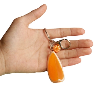 Realistic orange slice keychain with silver lobster clasp and decorative flower bead