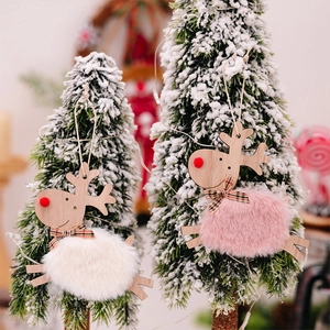 Close-up of plush wooden reindeer ornaments with faux fur balls and plaid bows
