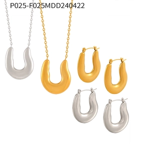 U-shaped horseshoe jewelry set including gold and silver necklaces with matching earrings