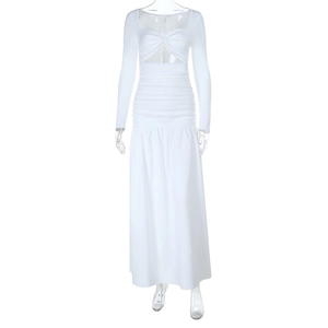 Detail view of white long sleeve dress with cutout twist front and gathered waist texture