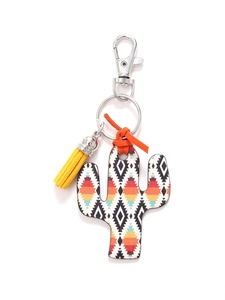 Detail of wooden cactus keychain with Aztec pattern print and yellow tassel fringe