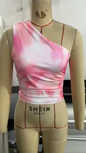 Detail of pink and white tie-dye one-shoulder top featuring stylish side ruched design