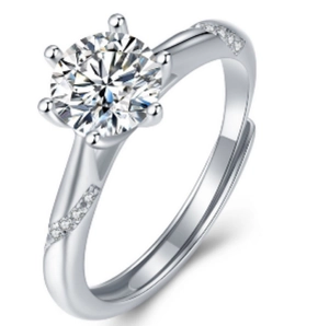 Macro detail of six-prong moissanite ring with round-cut center stone and adjustable band