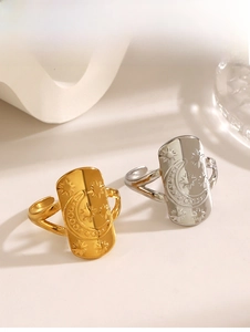 Detailed view of rectangular star and moon engraved rings in gold and silver finish