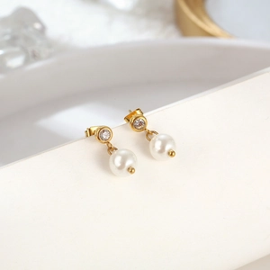 Elegant gold stainless steel C-shape earrings with sparkling crystals and white pearls