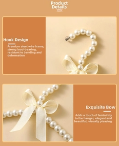 Detail of faux pearl hanger featuring a golden satin bow and reinforced steel hook