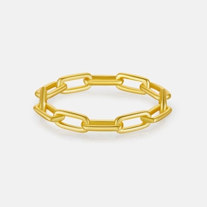 Detailed view of the gold-toned paperclip chain ring with a polished metallic finish