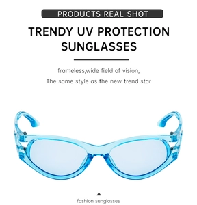 Detail of light blue rimless oval sunglasses with hollow temples and UV protection