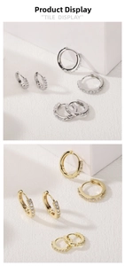 Detail of S925 silver huggie hoop earrings with micro-set cubic zirconia in gold and silver