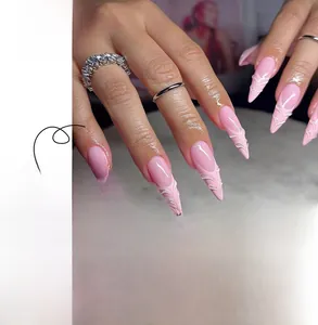 Detail of pink almond-shaped press-on nails featuring 3D water ripple textured finish