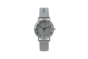 Detailed view of women's quartz watch with grey silicone strap and numeric dial