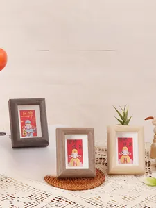 Three-piece wooden inspirational desk frames in dark, walnut, and natural wood finishes