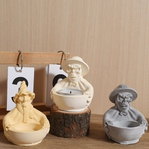 Halloween skull and wizard silicone candle holder molds with a textured stone finish