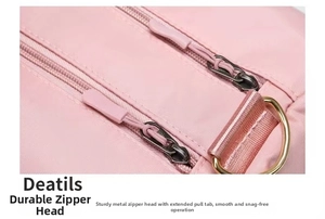 Detail of pink yoga bag featuring durable dual zippers and gold-toned metal D-ring hardware