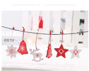 Set of six wooden Christmas ornaments featuring snowflake, bell, and tree hanging decorations