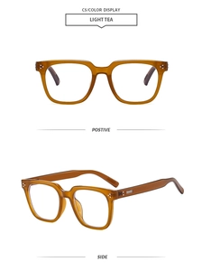 Detail view of square light tea eyeglass frames with silver rivets and transparent finish