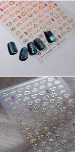 Detail of laser rainbow and gold auspicious cloud nail stickers with zen motifs