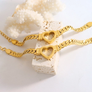 Hip-hop gold plated titanium Cuban chain bracelet with hollow heart pendant on stone decor