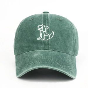 Close-up of deep green washed cotton baseball cap with white cartoon dog embroidery