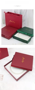 Deep red and dark green necklace jewelry box set with gold Jewelry logo and matching paper bag