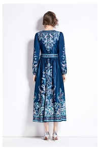 Full back view of a long-sleeved paisley print maxi dress with elegant satin sheen